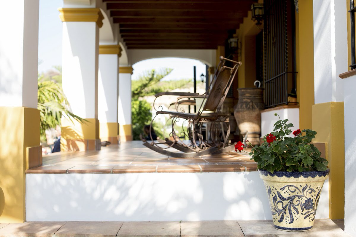 Spanish woden rocking chair on porch